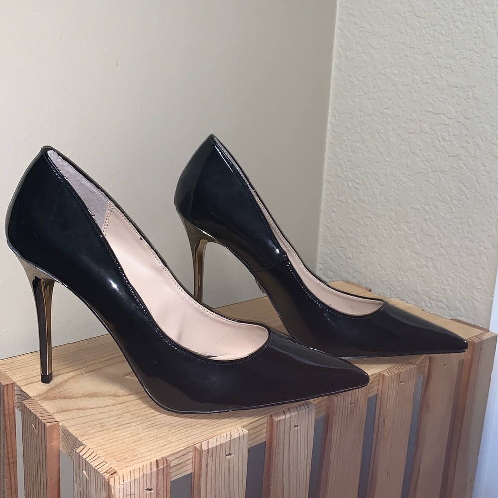 Black and silver stilettos never worn